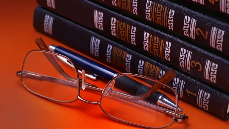 Glasses in front of learning books