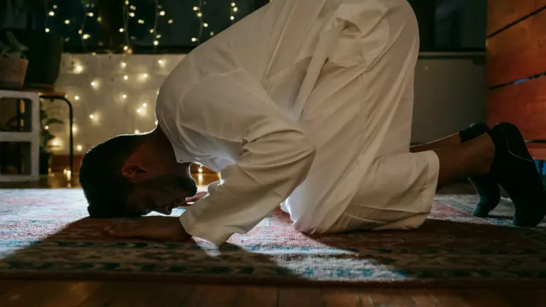 Man prostrating during the night prayer