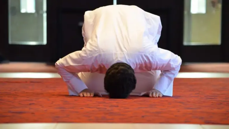 Man prostrating during Tarawih prayer