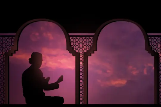Silhouette of a man supplicating at dusk