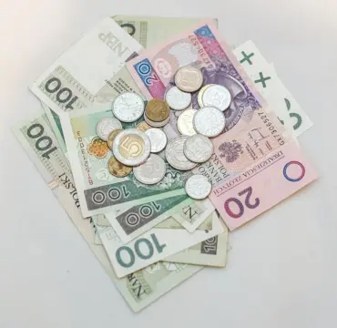 Banknotes and coins illustrating poverty