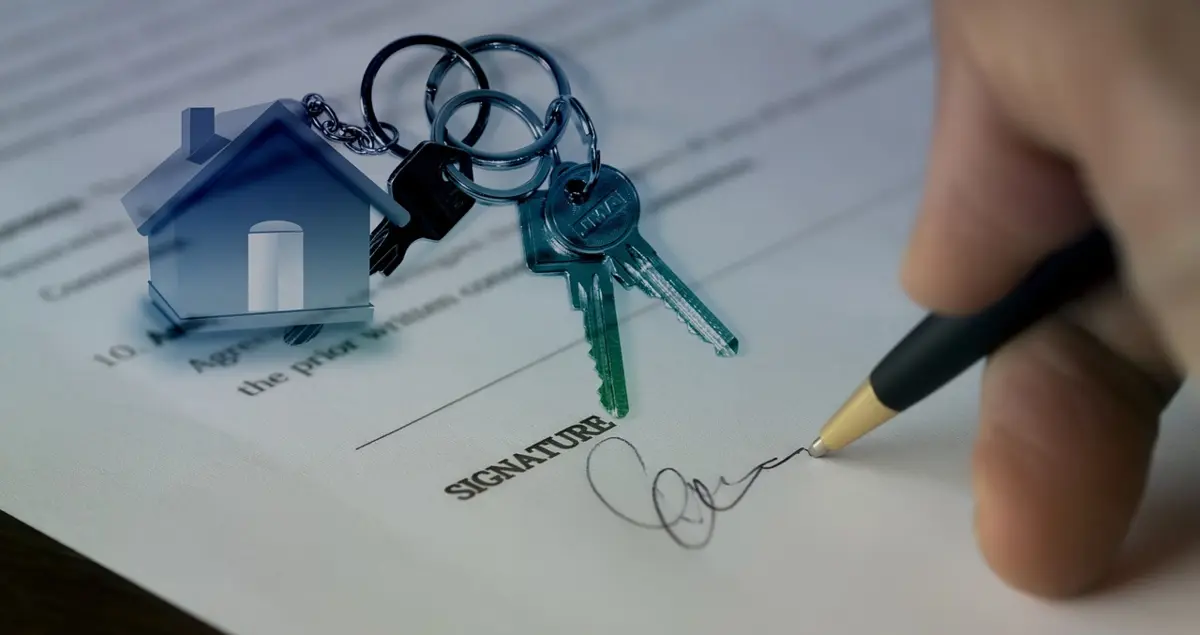 Signing a document with house keys