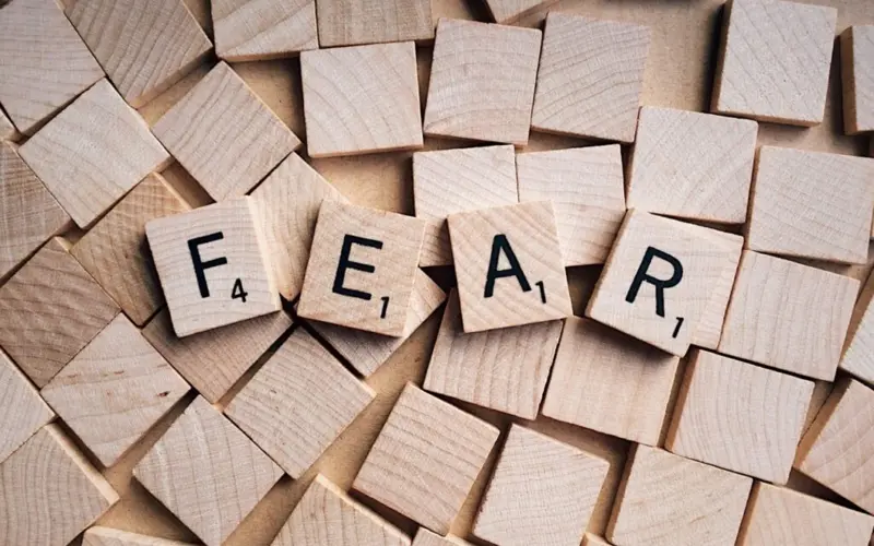 Word fear on wooden blocks illustrating parental concern