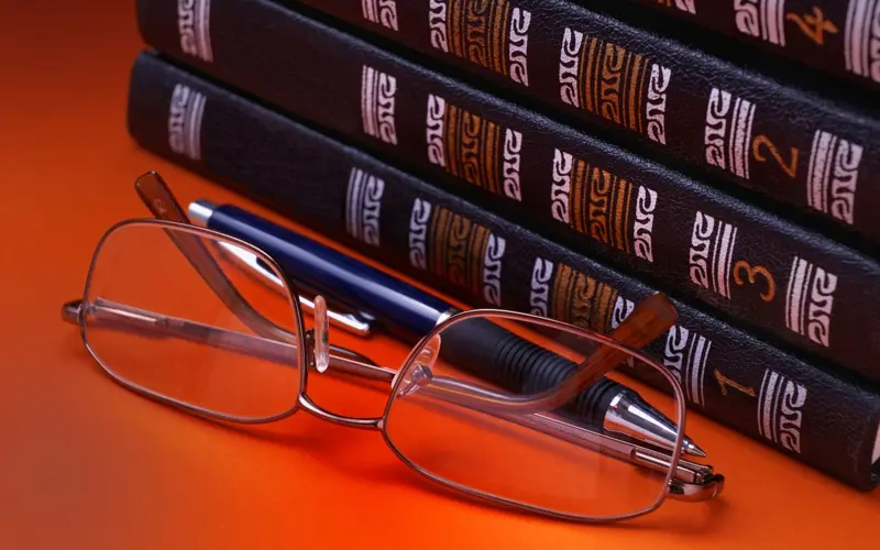 Glasses in front of learning books