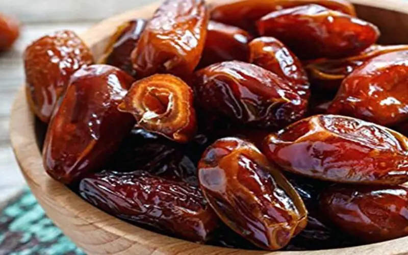 Glossy dates served on a plate