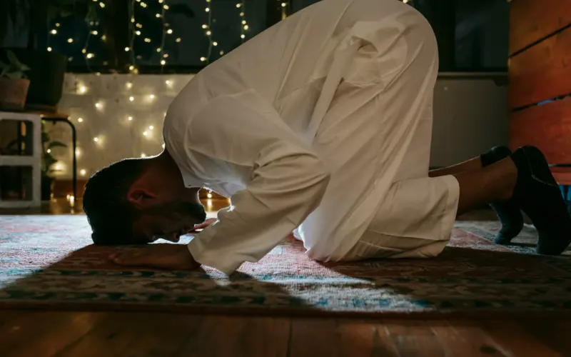 Man prostrating during the night prayer