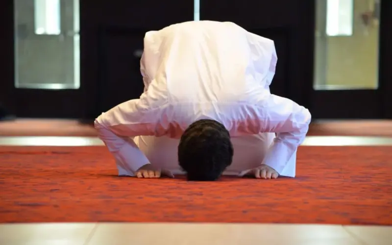 Man prostrating during Tarawih prayer