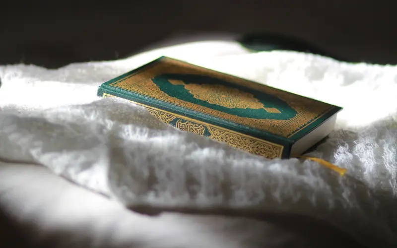 Quran placed on a white cloth