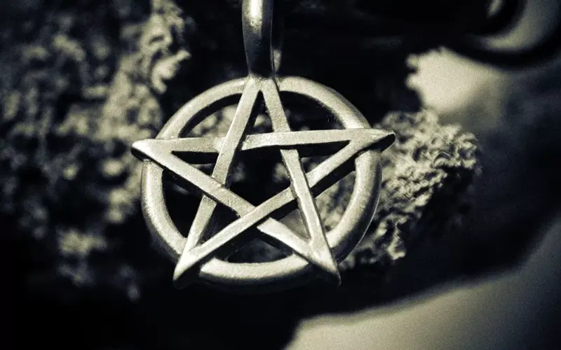 Pentagram pendant symbolizing witchcraft and occult practices