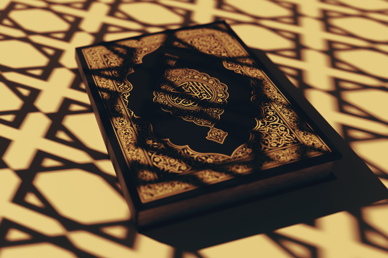 Quran under light with Islamic patterns