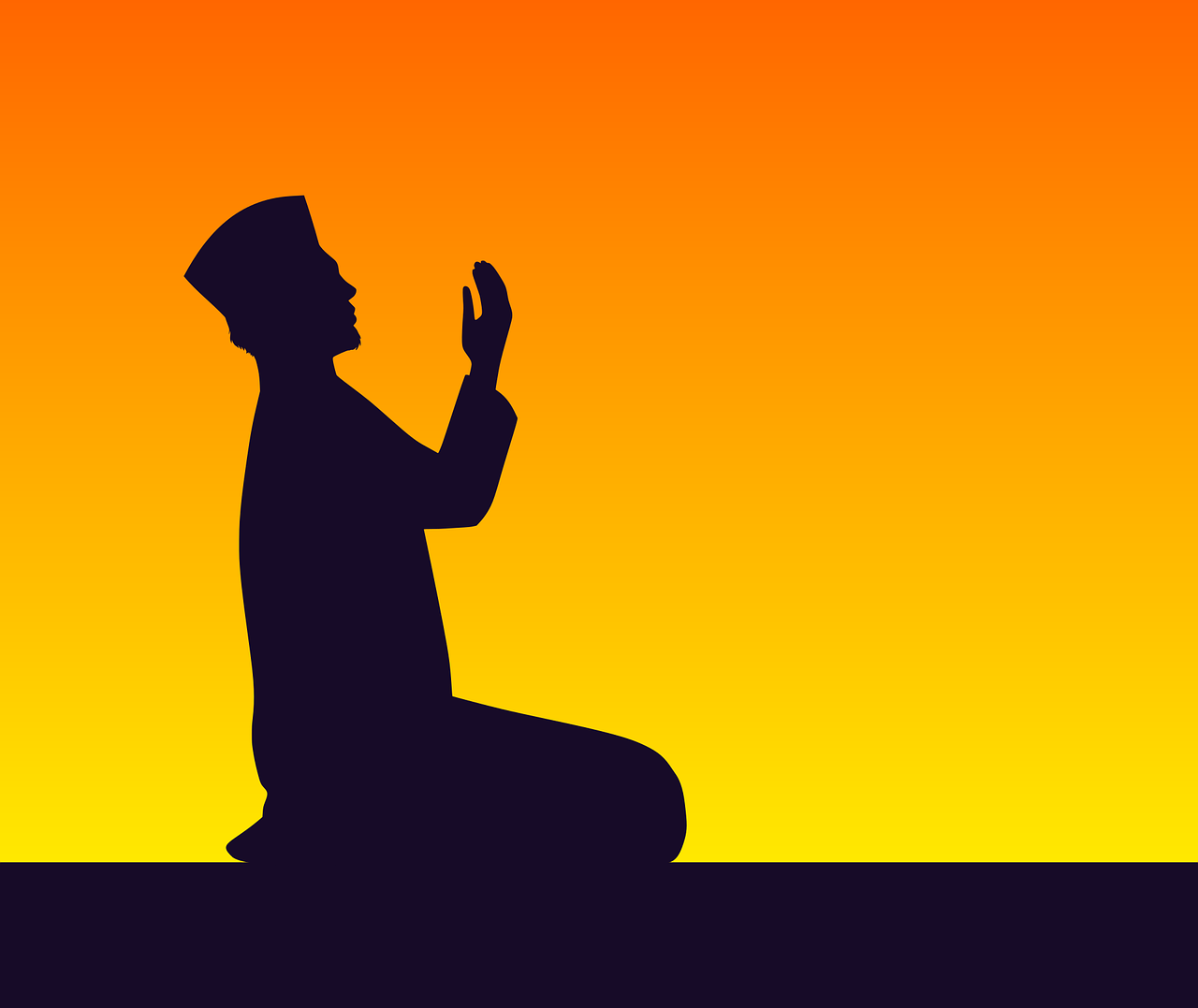 Silhouette of a Muslim praying with raised hands