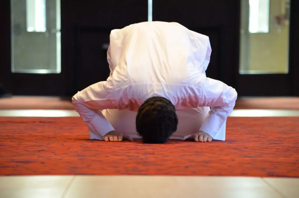 Man prostrating during Tarawih prayer