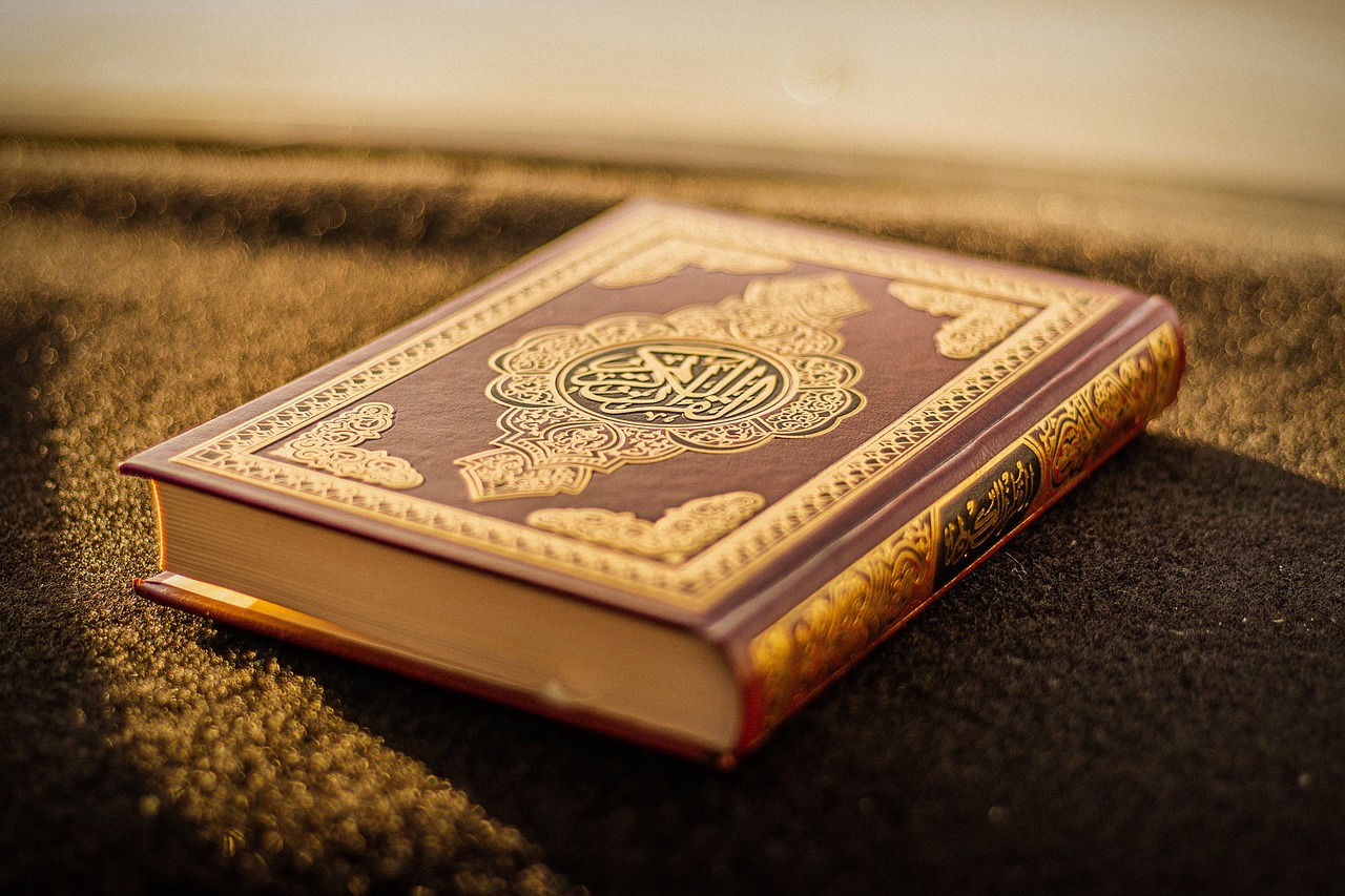 Closed Quran placed on a carpet